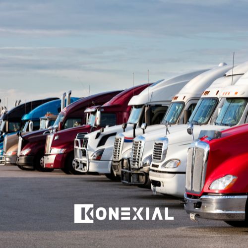 Fleet of commercial trucks lined up in a parking lot