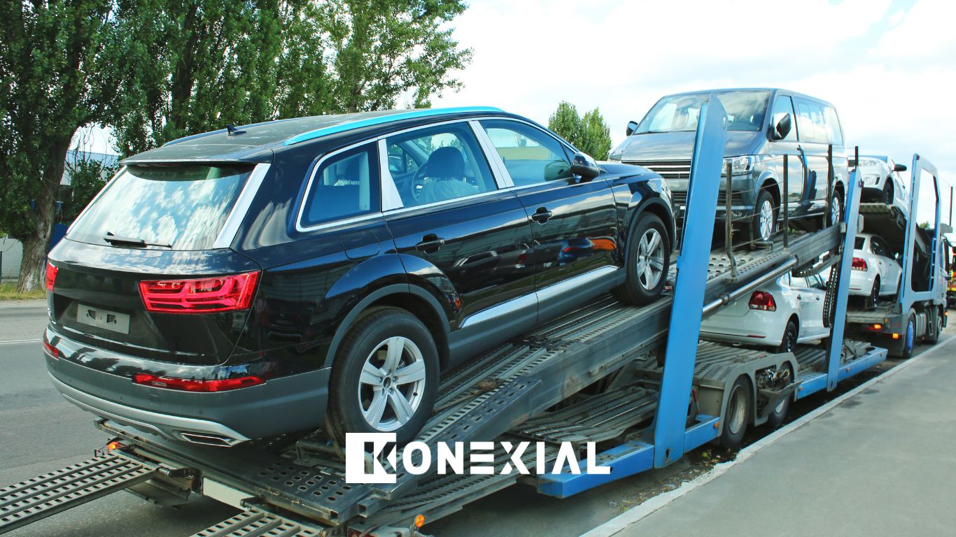Automotive truck carrying cars with black car.