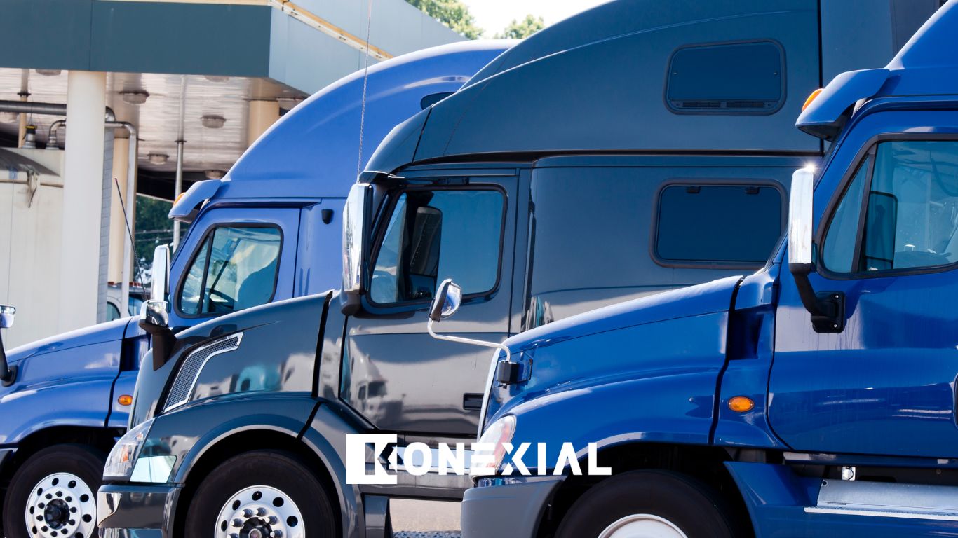 fleet of blue trucks in a parking lot