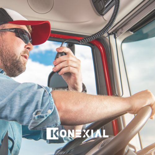 Hands gripping the wheel of a commercial truck