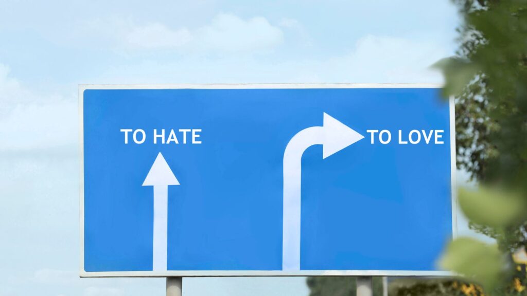 Road sign with to hate or to love
